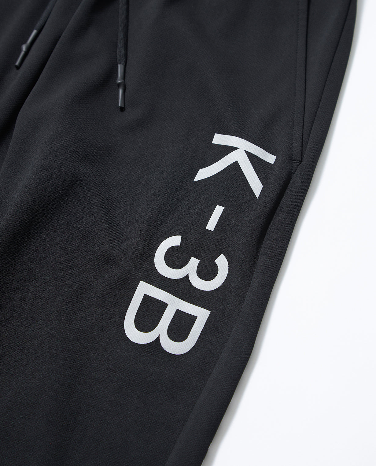 Black x White 115_G Recycled Yarn Mesh Graphic Jogger Pants